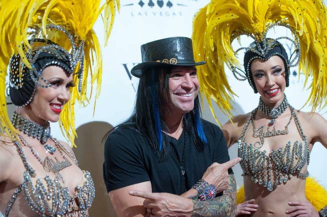 Michael Godard and "Jubilee!" showgirls arrive at the "Veronic Voices" premiere at Bally's on Friday, June 28, 2013.